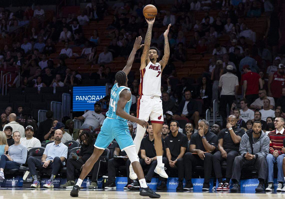 Miami Heat center Kel'el Ware (7) takes a shot as Charlotte Hornets forward Moussa Diabate (14) defends in the second half of their NBA game at Kaseya Center on Oct. 28, 2025, in Miami.