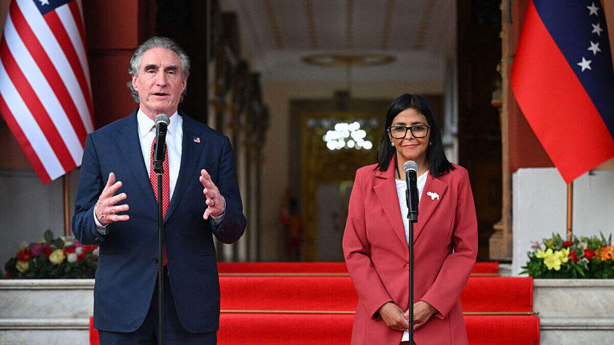 US Interior Secretary Doug Burgum speaks alongside Venezuela's interim president, Delcy Rodriguez, after their meeting at the Miraflores Presidential Palace in Caracas on March 4, 2026. US Interior Secretary Doug Burgum on March 4, 2026,  became the latest senior Trump administration official to visit Venezuela, as Washington pushes to ramp up oil and mineral production in the country. (Photo by Federico PARRA / AFP via Getty Images)