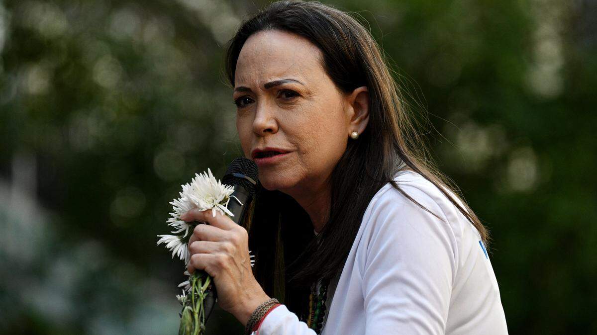 Venezuelan opposition leader Maria Corina Machado addresses supporters during a protest called by the opposition on the eve of the presidential inauguration, in Caracas on January 9, 2025. Machado, who emergend from hiding to lead protests against the swearing-in of Nicolas Maduro for a highly controversial third term as president, was arrested after being "violently intercepted upon exiting the rally," according to her security team. (Photo by Federico PARRA / AFP) (Photo by FEDERICO PARRA/AFP via Getty Images)