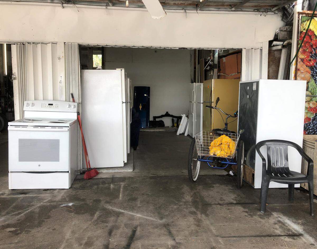 Refrigerators and electric stoves for sale in the Opa−Locka Hialeah Flea Market.