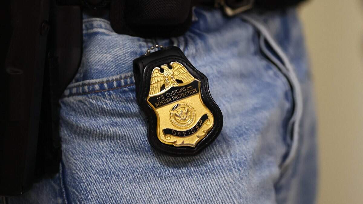 NEW YORK, NEW YORK - JUNE 18: The badge of a Customs and Border Protection agent is seen as they patrol the halls of immigration court at the Jacob K. Javits Federal Building on June 18, 2025 in New York City. Rep. Jerrold Nadler (D-NY), Rep. Dan Goldman (D-NY), NYC Comptroller and Mayoral Candidate Brad Lander and Council Member Alexa AvilÃ©s visited immigration courts to watch proceedings a day after NYC Comptroller and Mayoral Candidate Brad Lander was arrested by federal agents while accompanying a person out of a courtroom as people continue to be detained following immigration court hearings. (Photo by Michael M. Santiago/Getty Images)