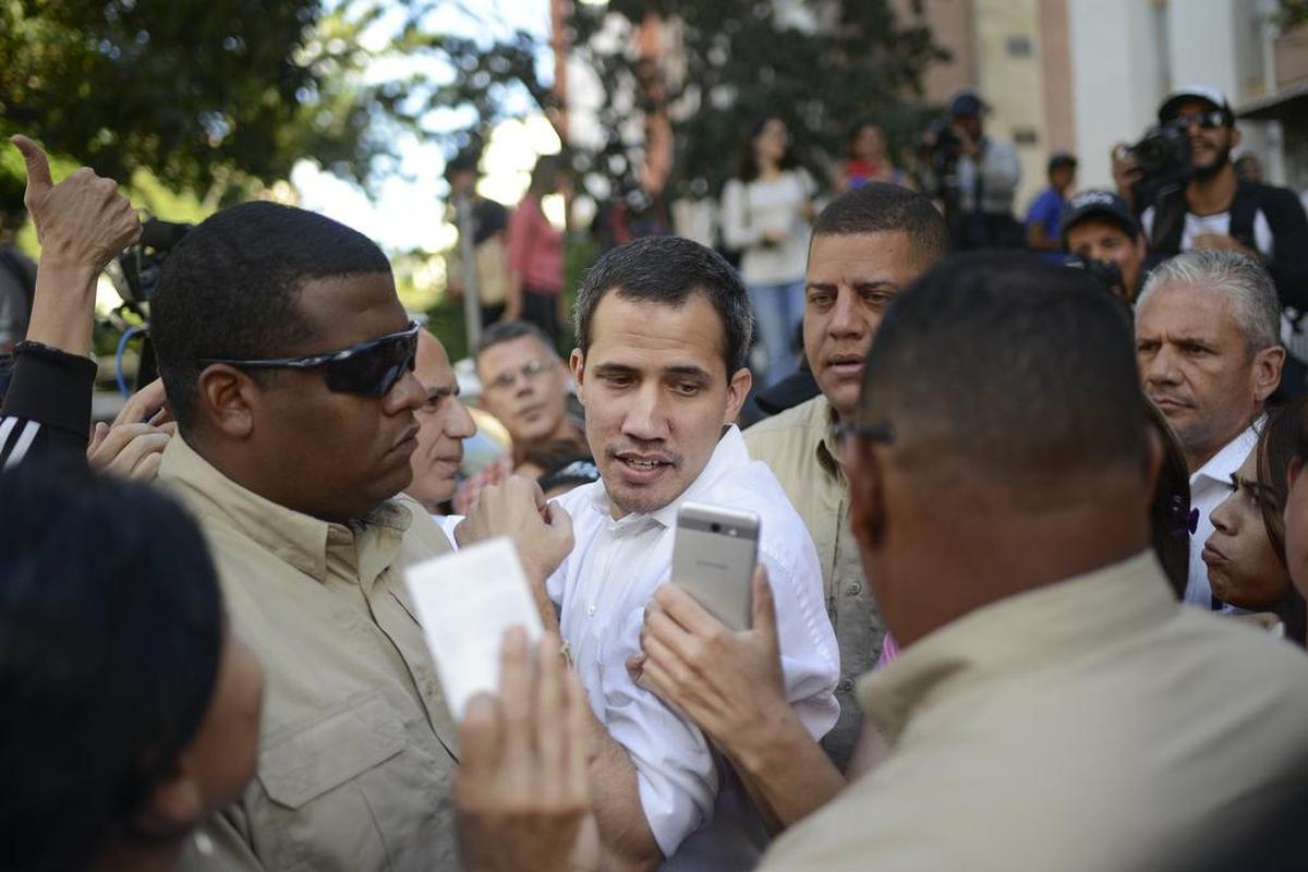 Opposition leader Juan Guaidó is surrounded by bodyguards after speaking to supporters in the Montalban neighborhood of Caracas, Venezuela, Saturday, Jan. 11, 2020. Venezuelans are deciding whether to heed Guaidó’s call for a new round of protests amid skepticism that he can still mobilize large numbers.