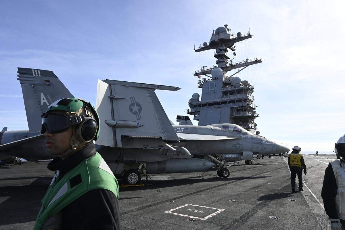 F-18E fighter jet is seen on aircraft carrier USS Gerald R. Ford as it sails during NATO Neptune Strike 2025 exercise on September 24, 2025 in the North Sea. According to NATO, more than 10,000 sailors, soldiers, aviators and marines from 13 allied nations took part in the large-scale multinational enhanced Vigilance Activity, running from September 22 to 26, 2025 in an area spanning the Mediterranean, Adriatic, North and Baltic Seas. (Photo by Jonathan KLEIN / AFP) (Photo by JONATHAN KLEIN/AFP via Getty Images)
