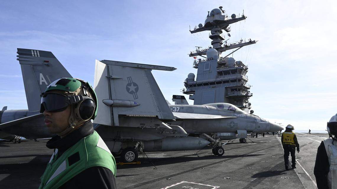 F-18E fighter jet is seen on aircraft carrier USS Gerald R. Ford as it sails during NATO Neptune Strike 2025 exercise on September 24, 2025 in the North Sea. According to NATO, more than 10,000 sailors, soldiers, aviators and marines from 13 allied nations took part in the large-scale multinational enhanced Vigilance Activity, running from September 22 to 26, 2025 in an area spanning the Mediterranean, Adriatic, North and Baltic Seas. (Photo by Jonathan KLEIN / AFP) (Photo by JONATHAN KLEIN/AFP via Getty Images)