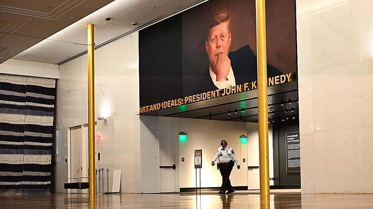 A security guard walks through the John F. Kennedy Center for the Performing Arts, which was recently renamed the "Trump Kennedy Center," in Washington, DC, on December 26, 2025. US President Donald Trump's name was affixed to the Kennedy Center in Washington on December 19, 2025, one day after his hand-picked board members voted to rename the arts venue in spite of legal questions. (Photo by Brendan Smialowski / AFP via Getty Images)