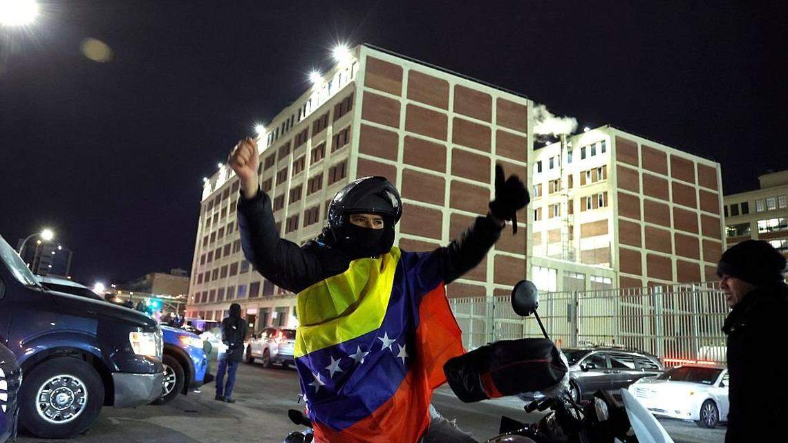 A Venezuelan supporter of the US miltary intervention in Venezuela celebrates in front of the Metropolitan Detention facility in the Brooklyn borough of New York, where ousted president Nicolas Maduro is expected to be held, on January 3. 2026 in New York City. Venezuelan President Nicolas Maduro arrived Saturday evening at a military base in the United States after his capture by US forces in Caracas. Maduro was seen surrounded by FBI agents as he descended the boarding stairs of a US government plane at a New York state National Guard facility, and was slowly escorted along the tarmac. (Photo by John Lamparski / AFP via Getty Images)