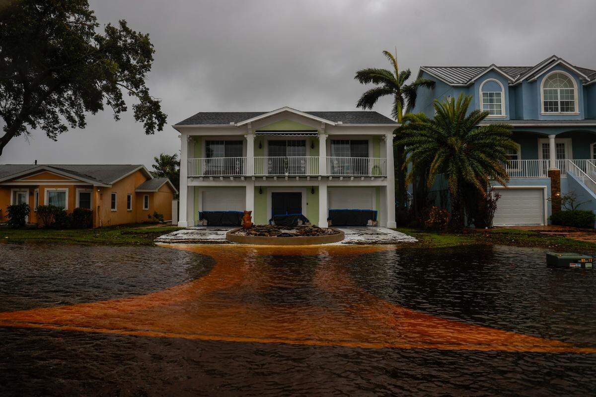 Water almost reaches houses along Shore Drive East near the R.E. Olds Park on Monday, Aug. 5, 2024, in Oldsmar.