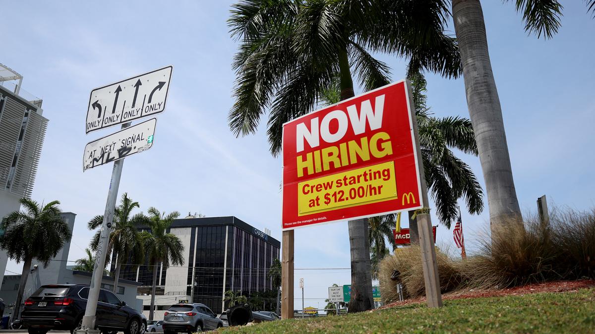 This file photo shows a “now hiring” sign outside a McDonald’s. What to know about Georgia’s regulations permitting teens to work.