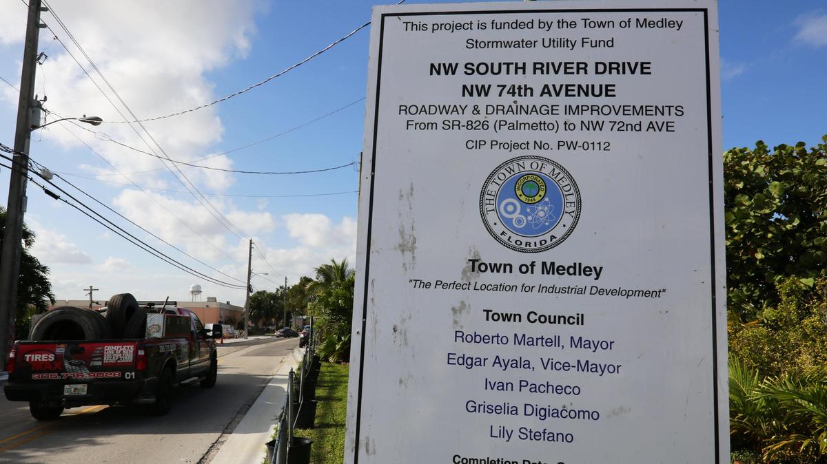 A sign with information about a roadway and drainage improvement project is seen on Northwest South River Drive in the Town of Medley, Florida, on Wednesday, Feb. 19, 2020.