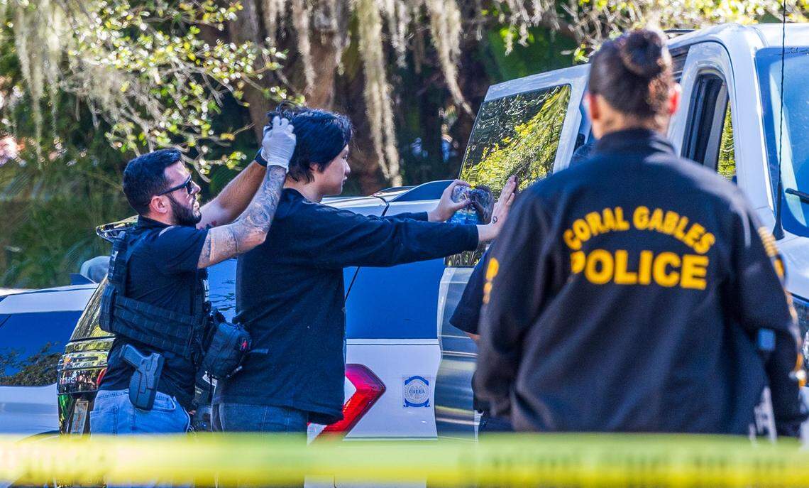 Multiple law enforcement officers are on the scene at Old Cutler Road and Southwest 120th Street in Coral Gables, where Coral Gables police and federal agents detained Chinese migrants on Tuesday, Jan. 28, 2025.
