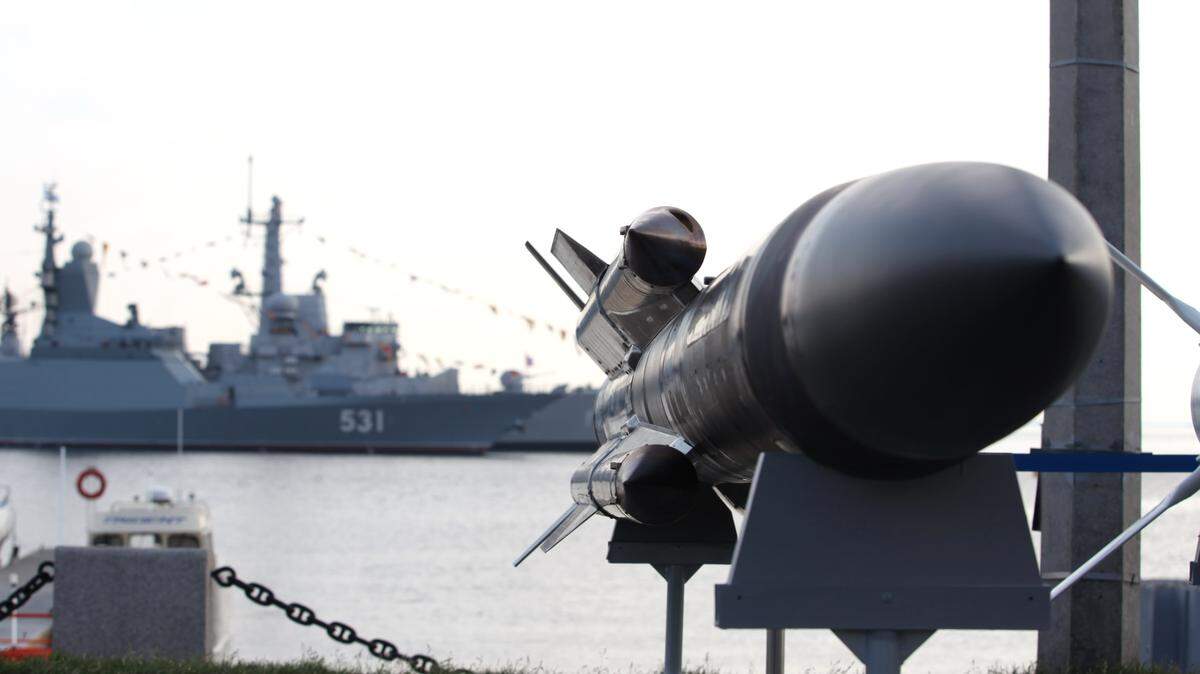 Anti-ship missiles against the background of a warship