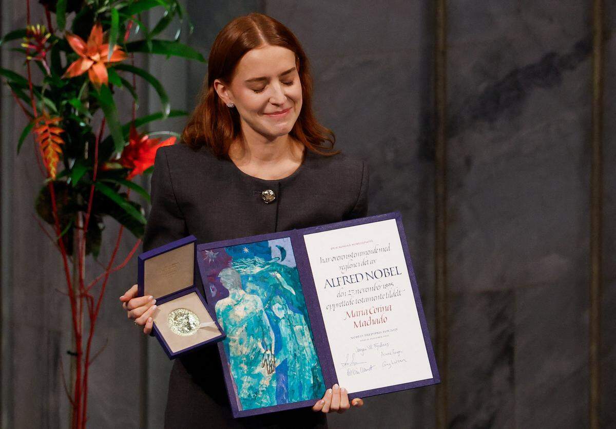Ana Corina Sosa, daughter of Venezuelan opposition leader Maria Corina Machado, receives the Nobel Peace Prize for her mother at the Nobel Peace Prize ceremony at Oslo City Hall on December 10, 2025 in Oslo, Norway. The 2025 Nobel Peace Prize was awarded to Machado for her efforts to bring democracy to Venezuela, challenging the iron-fisted rule of Venezuelan President Nicolas Maduro, who has been president since 2013. (Photo by Odd ANDERSEN / AFP via Getty Images)