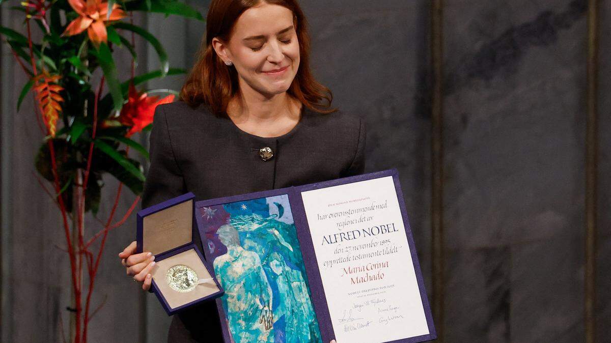 Ana Corina Sosa, daughter of Venezuelan opposition leader Maria Corina Machado, receives the Nobel Peace Prize for her mother at the Nobel Peace Prize ceremony at Oslo City Hall on December 10, 2025 in Oslo, Norway. The 2025 Nobel Peace Prize was awarded to Machado for her efforts to bring democracy to Venezuela, challenging the iron-fisted rule of Venezuelan President Nicolas Maduro, who has been president since 2013. (Photo by Odd ANDERSEN / AFP via Getty Images)