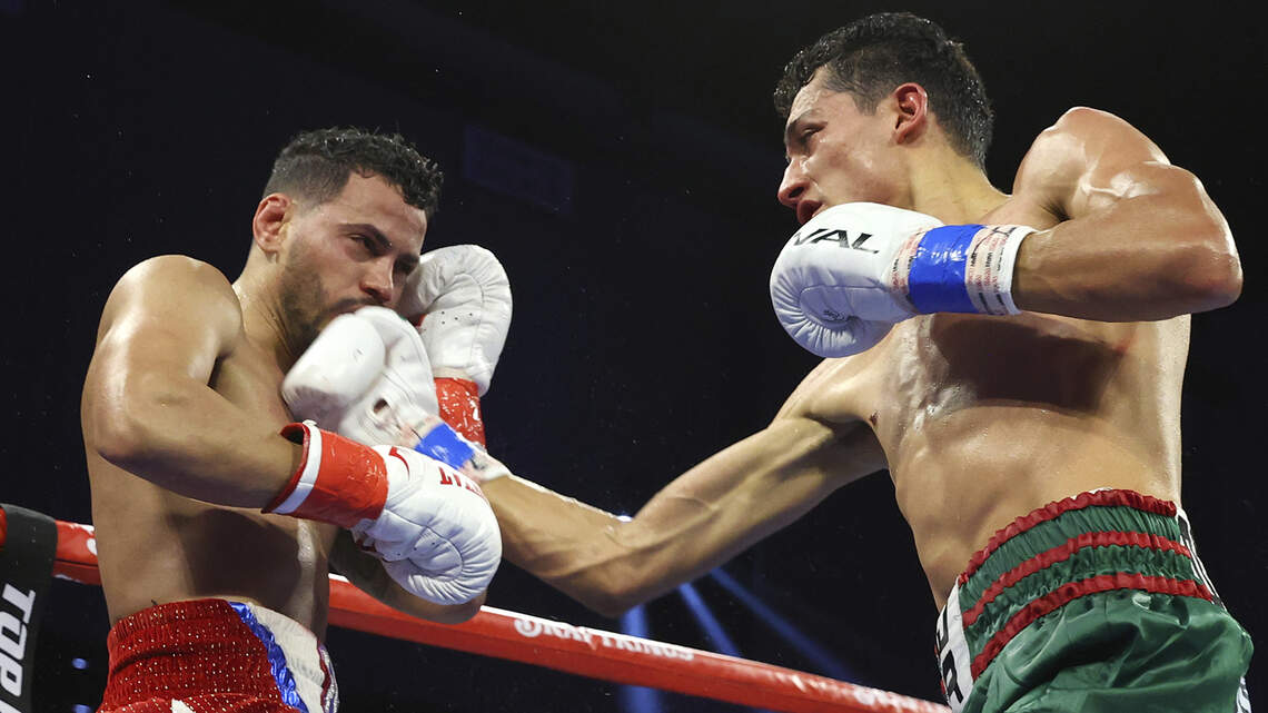Espnioza remains unbeaten, captures featherweight title belt in front of pro-Ramirez crowd