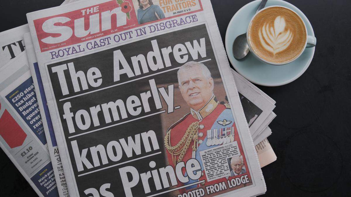 WINDSOR, ENGLAND - OCTOBER 31: In this photo illustration, the front page of The Sun newspaper with an image of Andrew Mountbatten Windsor is seen on October 31, 2025 in Windsor, England. King Charles III has started the formal process of removing the Titles, Styles and Honours of his brother, who will now be known as Andrew Mountbatten Windsor. Mr Mountbatten Windsor will also surrender the lease on Royal Lodge, where he has lived since 2004, and move to private accommodation. The historic move follows allegations of sexual abuse linked to the former prince's relationship with child sex offender Jeffrey Epstein. (Photo Illustration by Ming Yeung/Getty Images)