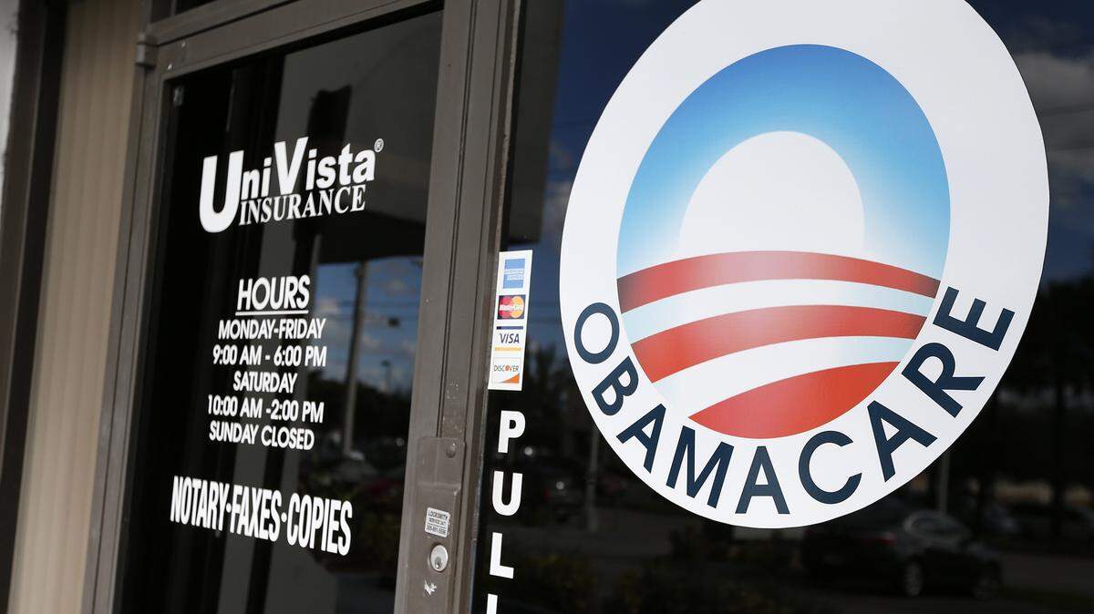An Obamacare logo is shown on the door of the UniVista Insurance agency in Miami, Florida on January 10, 2017. As President-elect Donald Trump's administration prepares to take over Washington, they have made it clear that overturning and replacing the Affordable Care Act is a priority. / AFP / RHONA WISE (Photo credit should read RHONA WISE/AFP via Getty Images)
