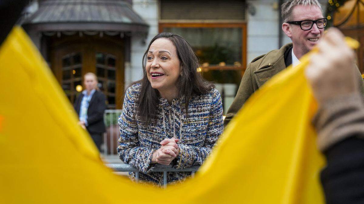 Nobel Peace Prize 2025 laureate Venezuelan opposition leader Maria Corina Machado stands next to the Deputy Leader of the Norwegian Nobel Committee Asle Toje (R) in front of the Grand Hotel in Oslo, Norway, after an audience at the Royal Palace. Machado -- who vanished in January 2025 after challenging the rule of Venezuelan President Nicolas Maduro -- won the 2025 Peace Prize for "her struggle to achieve a just and peaceful transition from dictatorship to democracy". (Photo by Ole Berg-Rusten / NTB / AFP via Getty Images) / Norway OUT