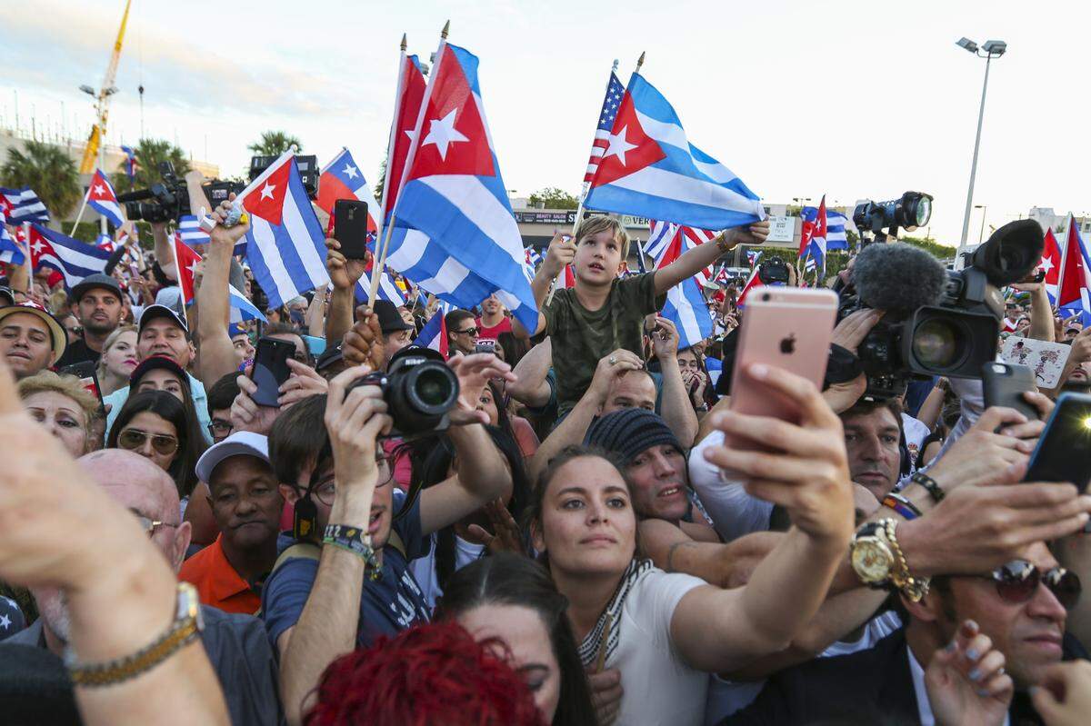 Hundreds of Cuban Americans gather in front of Versailles restaurant in Miami’s Little Havana after Fidel Castro’s death.
