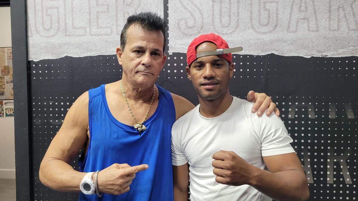 Billy Rodríguez y su entrenador Eufrasio González.