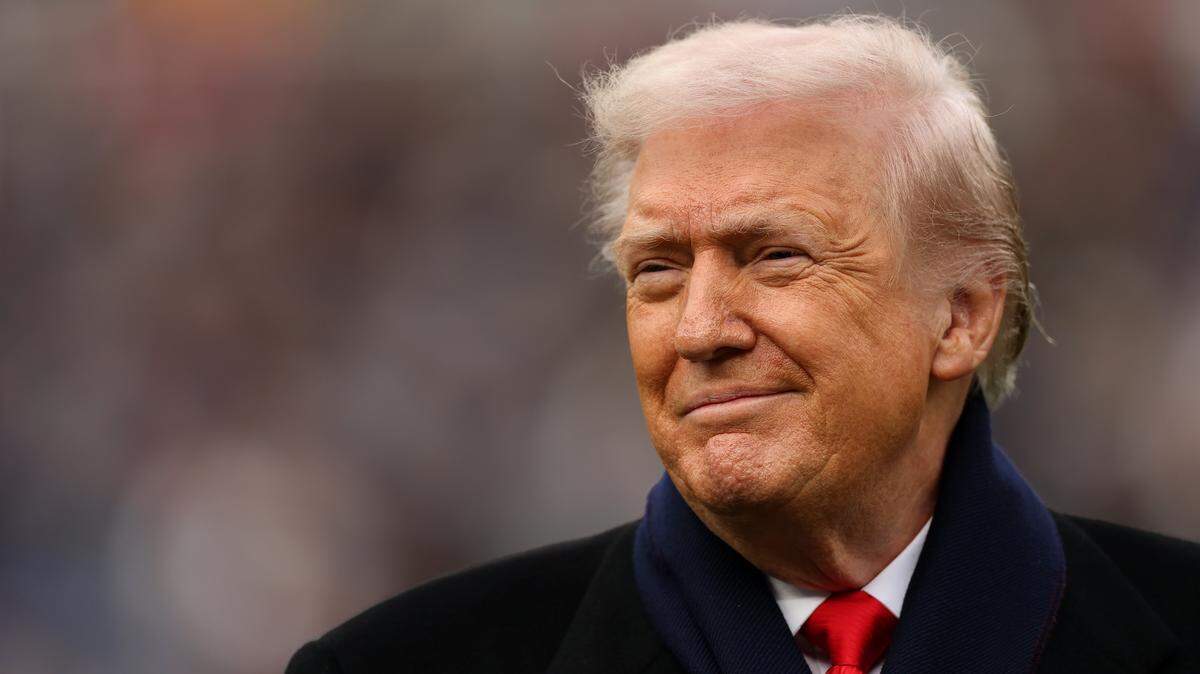 BALTIMORE, MARYLAND - DECEMBER 13: U.S. President Donald Trump smiles from the field before the 126th America's Game between the Army Black Knights and the Navy Midshipmen at M&T Bank Stadium on December 13, 2025 in Baltimore, Maryland. The teams are competing for the Commander-in-Chief's Trophy, with President Trump attending the rivalry for the second consecutive year. (Photo by Patrick Smith/Getty Images)