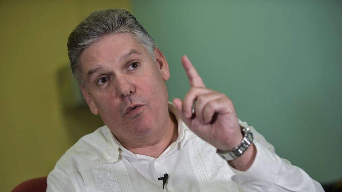Cuban Economy Minister Alejandro Gil talks during an interview with AFP at the Economy Ministry in Havana, on December 17, 2019. - With no date yet set, Cuba is preparing to reform its currency system and unify its two circulating currencies, the CUP, or Cuban peso, and the CUC, or convertible peso, which have been in use in the local market since 1994. (Photo by Yamil LAGE / AFP) (Photo by YAMIL LAGE/AFP via Getty Images)