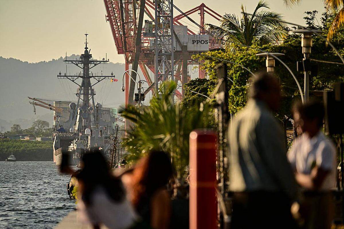 The USS Gravely warship is pictured docked at the port of Port of Spain on October 27, 2025. Trinidad and Tobago Prime Minister Kamla Persad-Bissessar on Monday rejected a threat by neighboring Venezuela to pull the plug on a joint gas project over her government's hosting of an American warship. (Photo by MARTIN BERNETTI / AFP) (Photo by MARTIN BERNETTI/AFP via Getty Images)