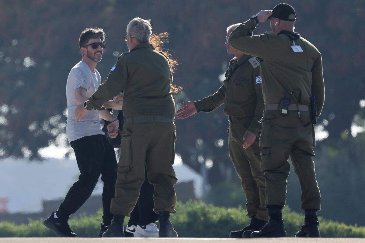David Cunio, one of the released Israeli hostages formerly held captive in Gaza since the 2023 October 7 attacks by Palestinian militants, is greeted upon his arrival at the Sheba Tel-HaShomer Medical Centre in Ramat Gan on October 13, 2025. (Photo by Ahmad GHARABLI / AFP) (Photo by AHMAD GHARABLI/AFP via Getty Images)