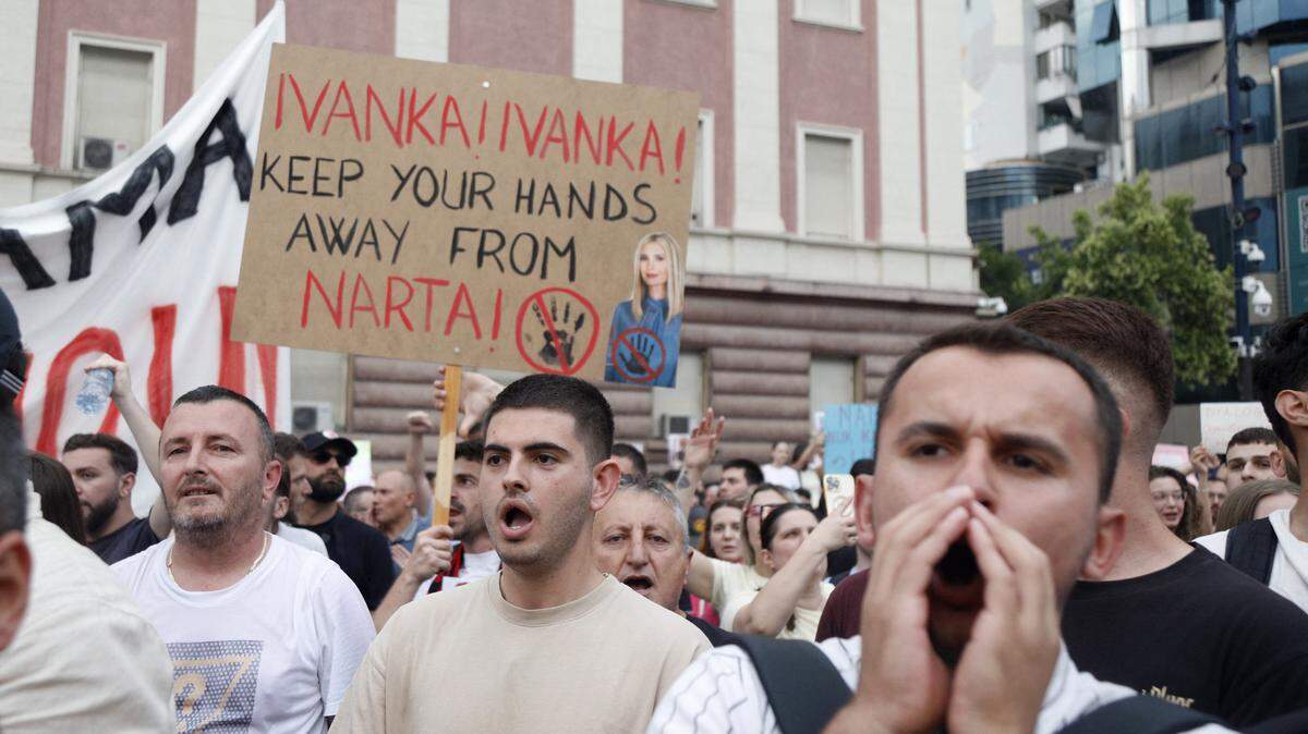 Protestors take part in a demonstration in front of the prime minister's office, against the construction of a luxury resort near a protected natural area, in Tirana on June 3, 2026. Citizens demonstrate for the fourth day to demand transparency around a tourist complex project allegedly linked to US President's son-in-law. (Photo by AFP via Getty Images)