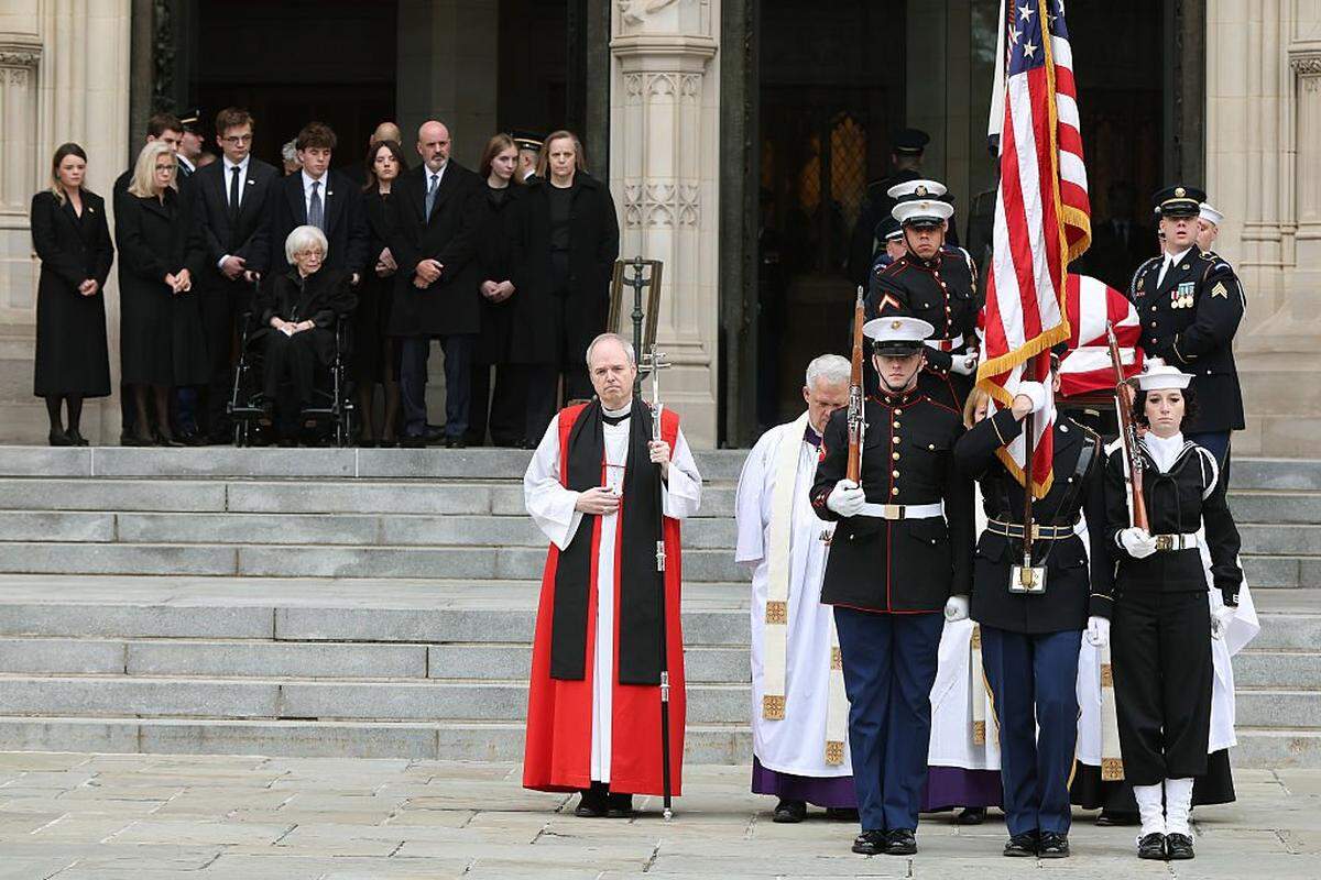 WASHINGTON, DC - NOVEMBER 20: U.S. military body bearers carry the casket containing the remains of former Vice President Dick Cheney out of the National Cathedral as members of the Cheney family watch, during Cheney's funeral service on November 20, 2025 in Washington, DC. Cheney, who served as the 46th Vice President under President George W. Bush and as the 17th Secretary of Defense, passed away at the age of 84 due to complications from pneumonia and vascular disease. (Photo by Anna Moneymaker/Getty Images)