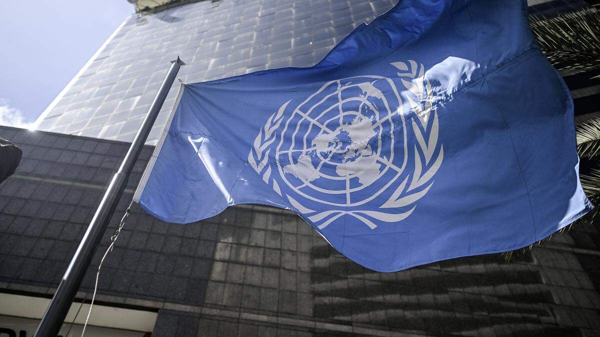 The United Nations flag waves in front of its office building in Caracas on December 16, 2025. Venezuela has complained to the UN Security Council (UNSC) about the US "theft" of an oil tanker seized in the Caribbean last week, according to a foreign ministry letter seen on December 16, 2025. (Photo by Juan BARRETO / AFP via Getty Images)