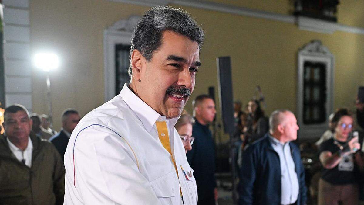 Venezuela's President Nicolas Maduro gestures as he arrives for the projection of a biographical series at the National Theatre of Venezuela in Caracas on November 22, 2025. (Photo by Juan BARRETO / AFP via Getty Images)