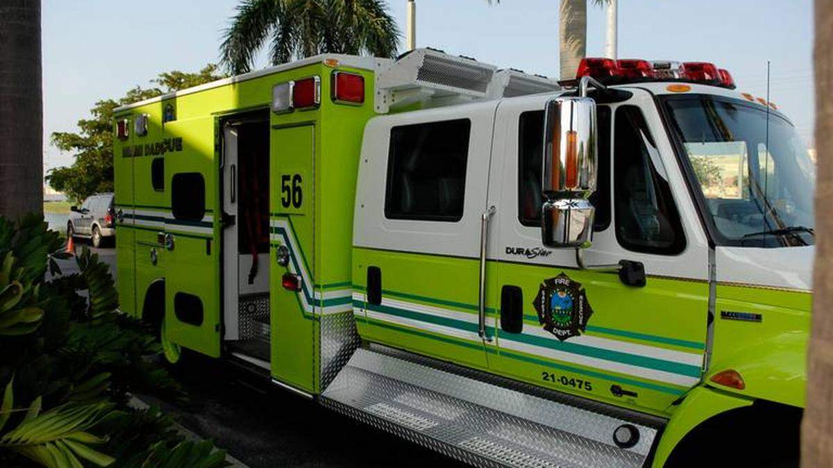 Luggage falling on the gas of a wheelchair service cart at Miami International Airport sent two people to the hospital after the ensuing crash, authorities say.