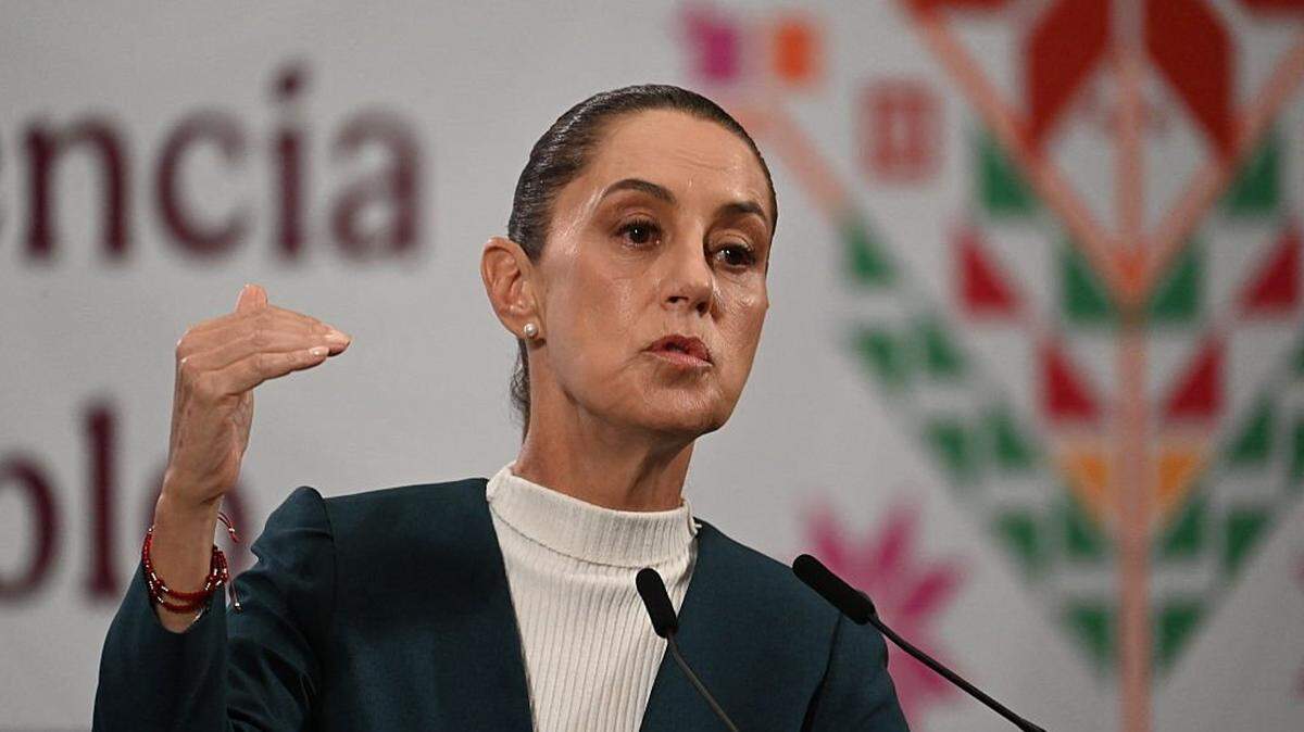Mexico's President Claudia Sheinbaum speaks during her daily press conference at Palacio Nacional in Mexico City on October 13, 2025 . At least 64 people have died and 65 remain missing in Mexico following heavy rains that caused flooding and left a trail of destruction in the worst-affected states of Hidalgo, Puebla, Queretaro and Veracruz, the government announced. (Photo by YURI CORTEZ / AFP) (Photo by YURI CORTEZ/AFP via Getty Images)