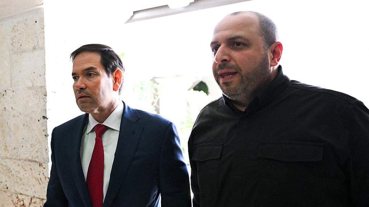 (L/R) US Secretary of State Marco Rubio and Secretary of the National Security and Defense Council of Ukraine Rustem Umerov speak to reporters after their meeting in Hallandale Beach, Florida on November 30, 2025. Rubio hailed talks with a Ukrainian delegation in Florida as "very productive," but cautioned that more work was required to halt Russia's war with its neighbor. (Photo by CHANDAN KHANNA / AFP via Getty Images)