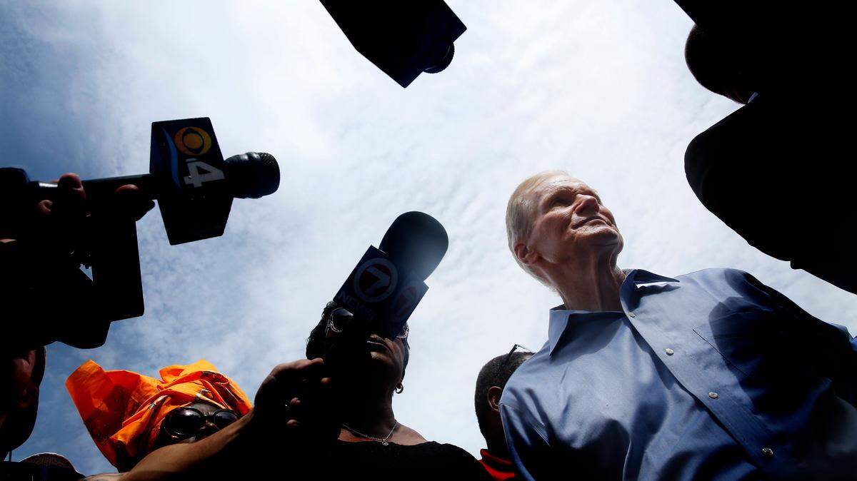 U.S. Sen. Bill Belson speaks with reporters during a visit to Miami on July 6.