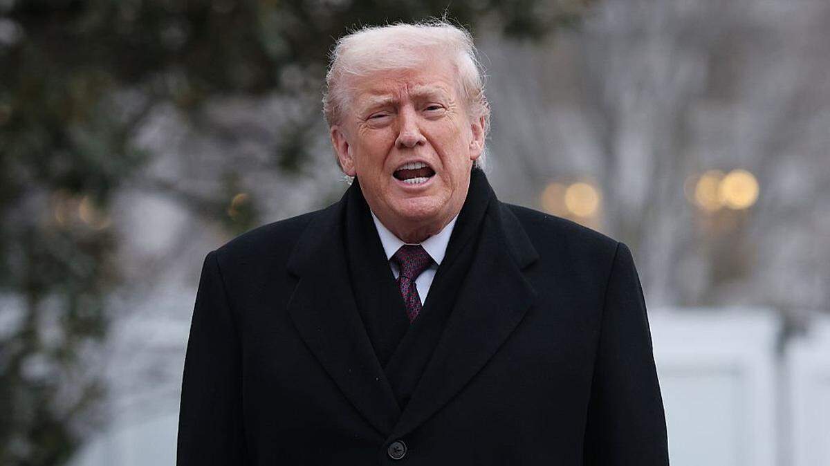 WASHINGTON, DC - DECEMBER 17: U.S. President Donald Trump shouts an answer to a reporter's question as he returns to the White House December 17, 2025 in Washington, DC. Earlier, Trump attended a dignified transfer ceremony at Dover Air Force Base for two members of the Iowa National Guard killed in Syria. (Photo by Win McNamee/Getty Images)