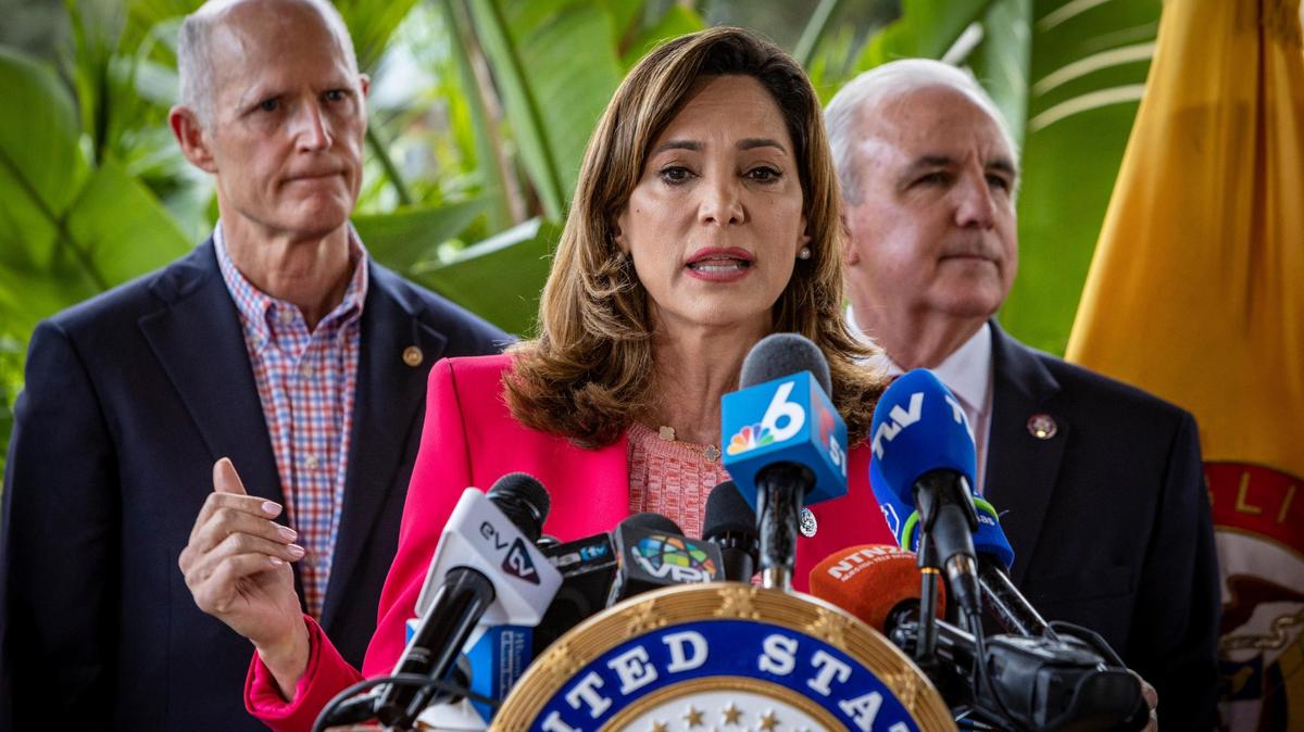 In this file photo, Miami U.S. Rep. María Elvira Salazar speaks during a press conference in Doral, with Sen. Rick Scott, left, and U.S. Rep. Carlos Giménez behind her.