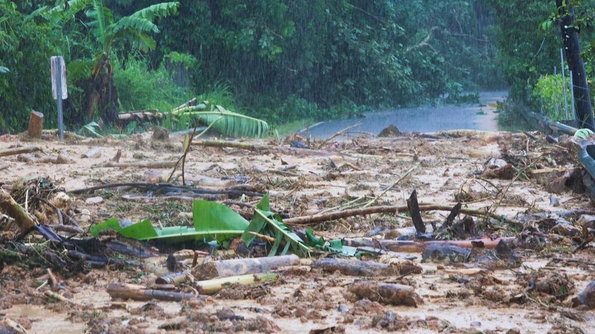 A highway is blocked by a mudslide caused by Hurricane Fiona in Cayey, Puerto Rico.