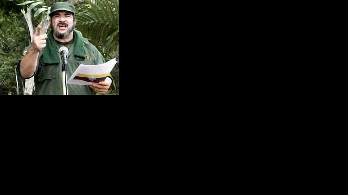 Rodrigo Londoño Echeverri (alias "Timochenko''), cuando confirmó la muerte del líder de las FARC Manuel Marulanda, en mayo del 2008. El gobierno de Colombia anunció el jueves 9 de octubre del 2014 que "Timochenko" ha visitado de manera clandestina a Cuba, lugar en donde se realizan las conversaciones de paz entre el gobierno y la guerrilla.  
