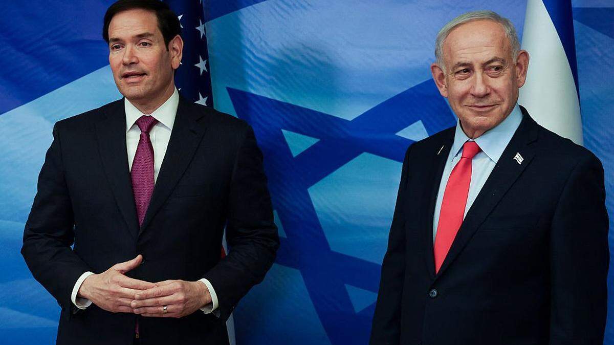 US Secretary of State Marco Rubio (L) and Israel's Prime Minister Benjamin Netanyahu speak to the media following their meeting at the Prime Minister's office in Jerusalem on October 23, 2025. Rubio voiced confidence on October 23 in maintaining and expanding a Gaza truce deal as he met Israeli Prime Minister Benjamin Netanyahu. (Photo by Ronen Zvulun / POOL / AFP) (Photo by RONEN ZVULUN/POOL/AFP via Getty Images)
