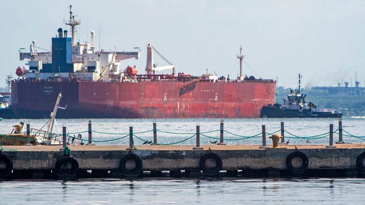 A crude oil tanker is anchored on Lake Maracaibo near Maracaibo, Zulia state, Venezuela, on December 18, 2025. Venezuela struck a defiant note on December 17, insisting that its crude oil exports were not impacted by US President Donald Trump's announcement of a potentially crippling blockade. (Photo by Alejandro Paredes / AFP via Getty Images)