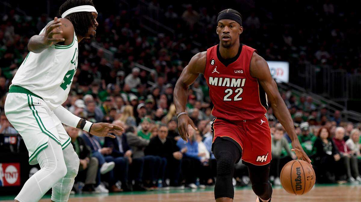 May 17, 2023; Boston, Massachusetts, USA; Miami Heat forward Jimmy Butler (22) dribbles against Boston Celtics center Robert Williams III (44) during the first quarter in game one of the Eastern Conference Finals for the 2023 NBA playoffs at TD Garden. Mandatory Credit: Bob DeChiara-USA TODAY Sports