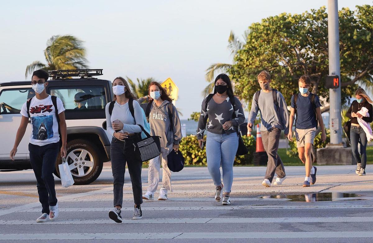 Students walk to the MAST Academy on the first day back of in-person learning, Wednesday, Oct. 7. A few days after the school reopened, administrators closed the school for one day due to two students testing positive for COVID-19.