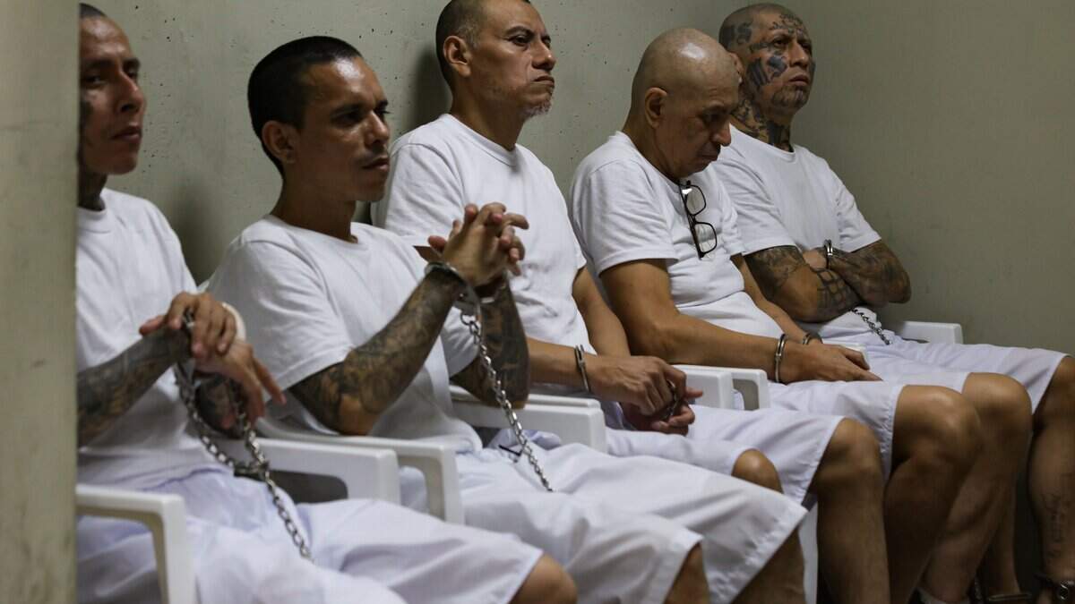 TECOLUCA, EL SALVADOR - APRIL 23: Prison inmates listen during a massive hearing against criminals and gang members at CECOT on April 23, 2026 in Tecoluca, El Salvador. In 2023, El Salvador opened Latin America's largest prison as part of President Nayib Bukele's plan to fight gangs. The government says some 20,000 gang members are being held at the mega-prison, which has a capacity of 40,000. (Photo by Alex Peña/Getty Images)