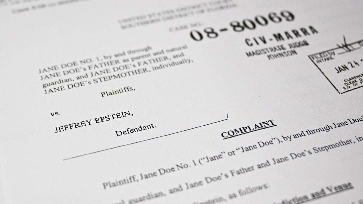 This photo illustration taken in Washington, DC, on December 19, 2025 shows a court document after the US Justice Department began releasing the long-awaited records from the investigation into the politically explosive case of convicted sex offender Jeffrey Epstein. (Photo by Mandel NGAN / AFP via Getty Images)