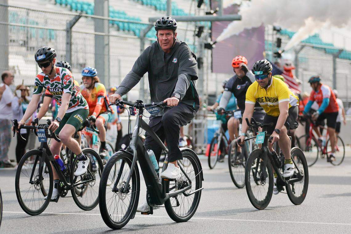 Miami Dolphins legend Dan Marino (center, in black) participates in the Dolphins Cancer Challenge at Hard Rock Stadium on Feb. 24, 2024 in Miami Gardens, Florida.