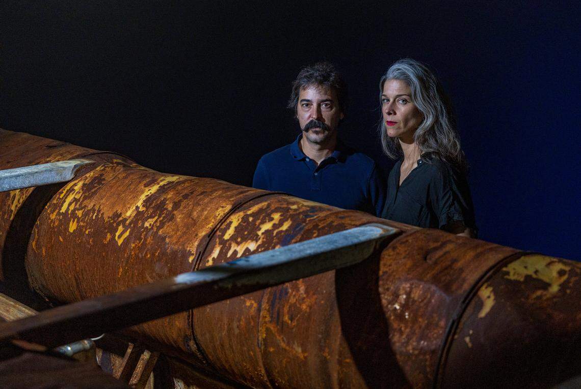 Cuban American artists Antonia Wright and Ruben Millares stand next to a raft used by Cubans fleeing the island, that was recovered from the coast of Miami in 2022, after washing ashore in Key Biscayne, Florida. The raft is part of their new show titled ‘Exile’ at the Piero Atchugarry Gallery, in Miami, on Friday, February 20, 2026.