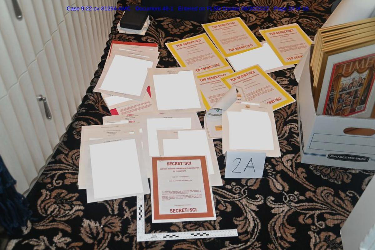 Image contained in a court filing by the Department of Justice on Aug. 30, 2022 of a redacted FBI photograph of certain documents and classified cover sheets recovered from a container in the “45 office” seized during the Aug. 8 search by the FBI of former President Donald Trump’s Mar-a-Lago estate in Florida.