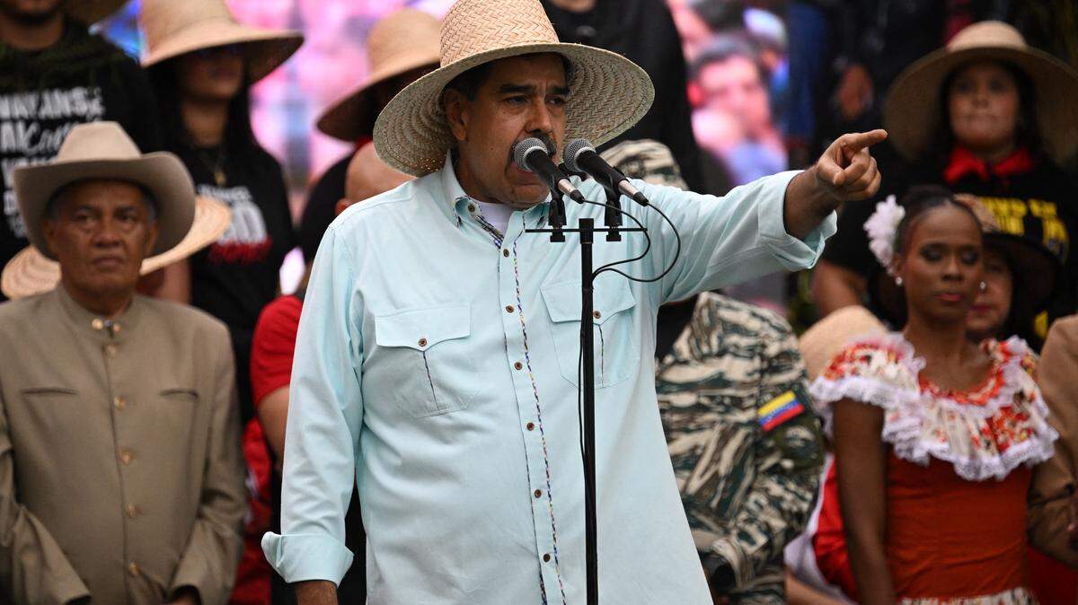 Venezuela's President Nicolas Maduro speaks to his supporters during a rally to mark the anniversary of the Battle of Santa Ines, in Caracas on December 10, 2025. (Photo by Federico PARRA / AFP via Getty Images)