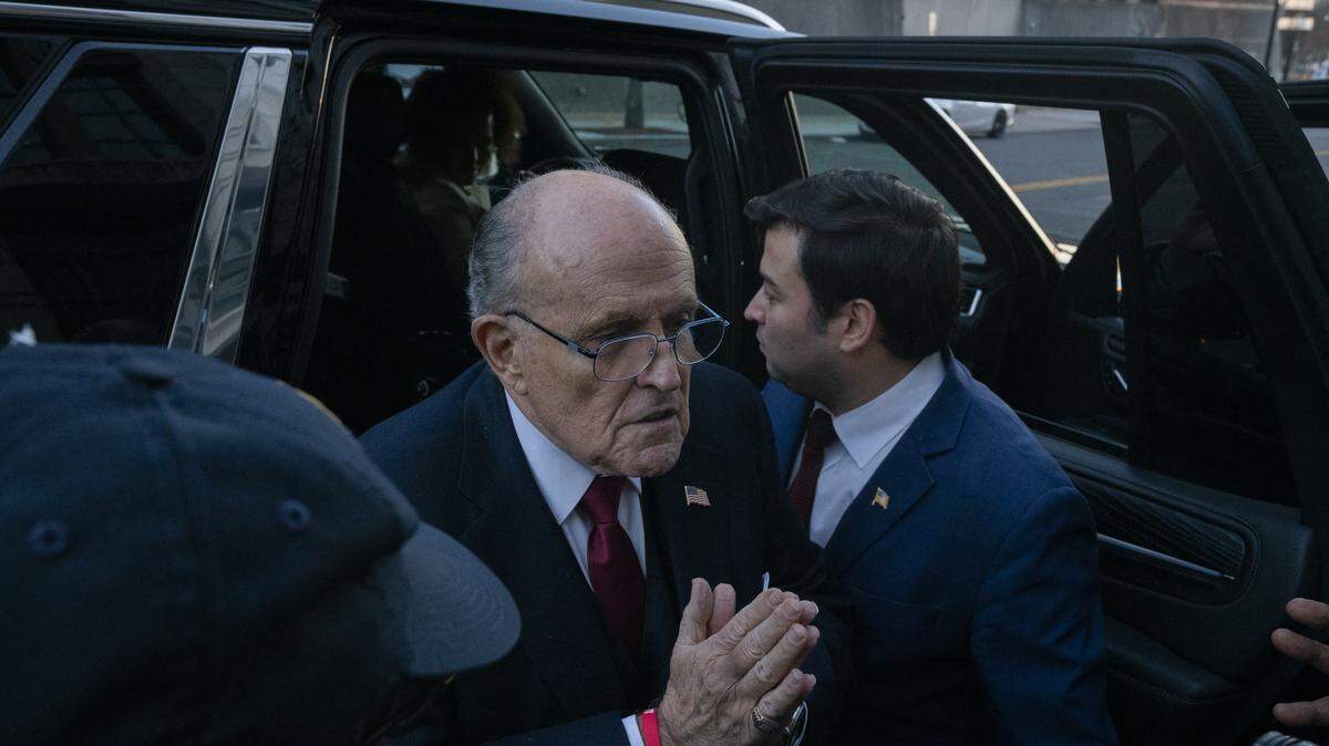 Rudy Giuliani, the former personal lawyer for former U.S. President Donald Trump, departs from the E. Barrett Prettyman U.S. District Courthouse after a verdict was reached in his defamation jury trial on December 15, 2023 in Washington, DC. A jury has ordered Giuliani to pay $148 million in damages to Fulton County election workers Ruby Freeman and Shaye Moss. 23. (Photo by Andrew Thomas/NurPhoto) (Photo by Andrew Thomas / NurPhoto via AFP)